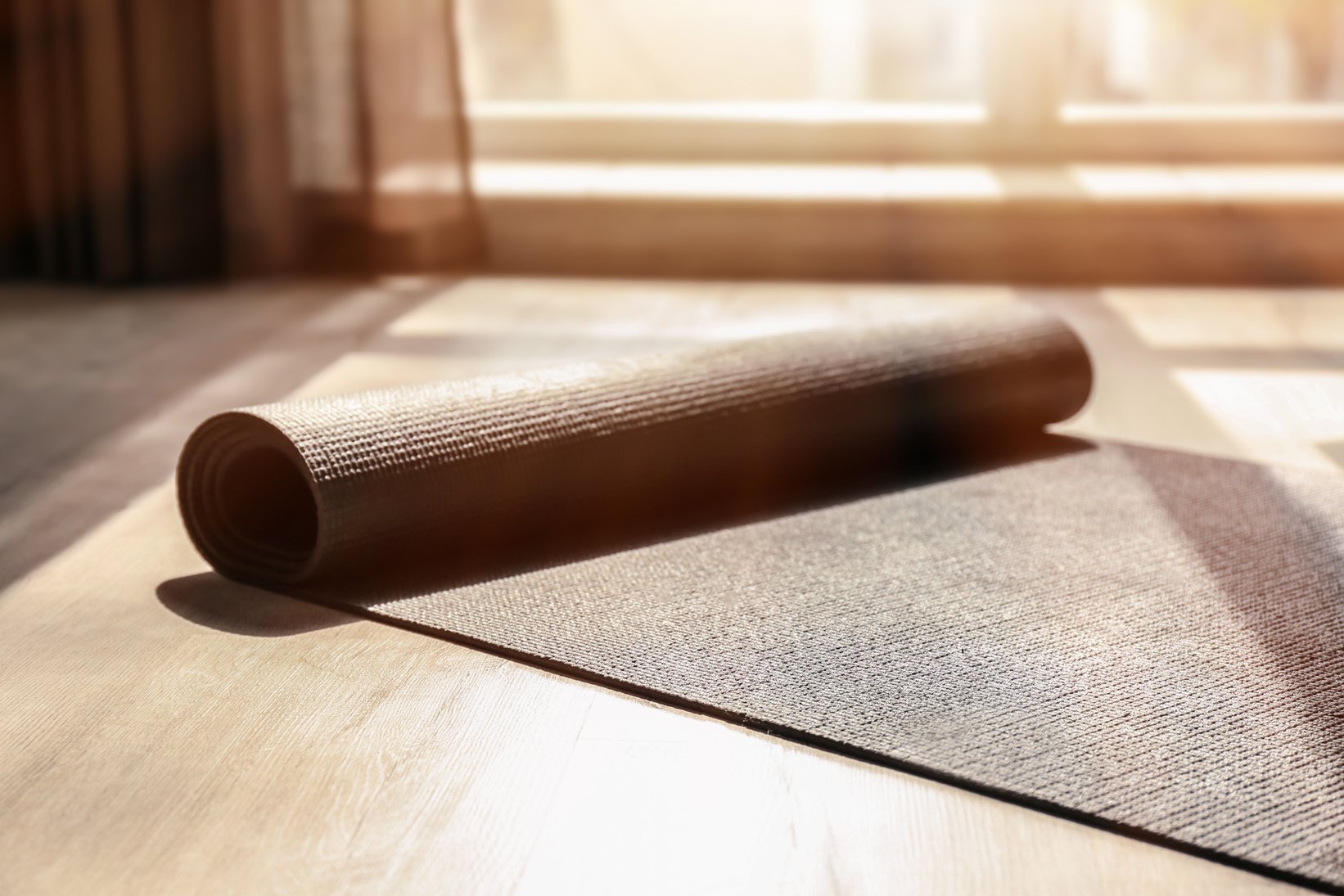 Yoga Mat on Wooden Floor